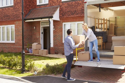 Professional movers loading items into a van for a local Hampstead removal