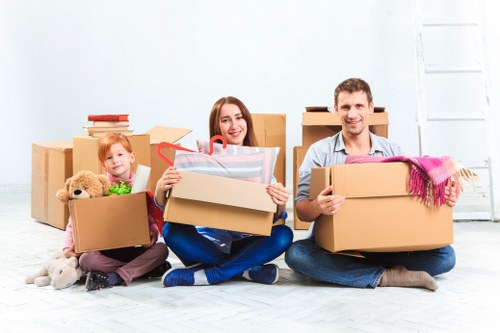 Professional movers handling furniture in a Hampstead property