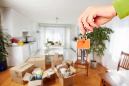 Movers transporting heavy furniture in Hampstead