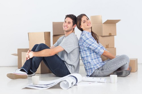Removal workers using PPE while handling household items