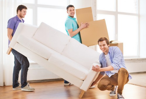 Packed household boxes and protected furniture ready for a Hampstead relocation