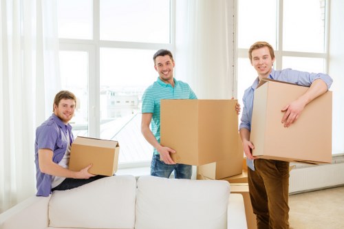 Office furniture and boxes arranged for a Hampstead commercial move