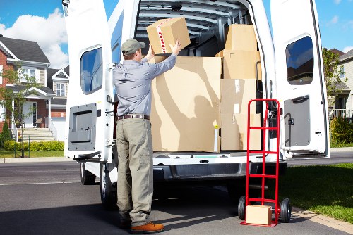 Professional movers carrying furniture during a local relocation in Hampstead