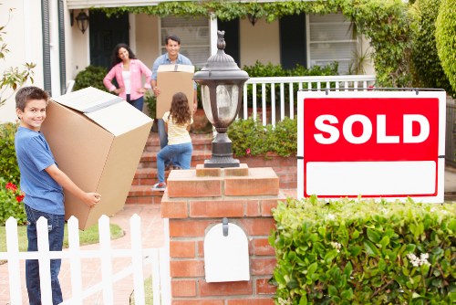 Helper carrying items through a Hampstead residential property