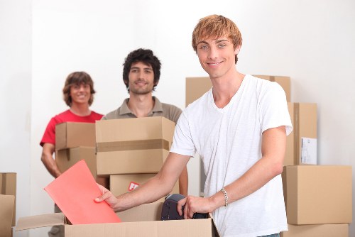 Office relocation setup with boxes and equipment in Hampstead