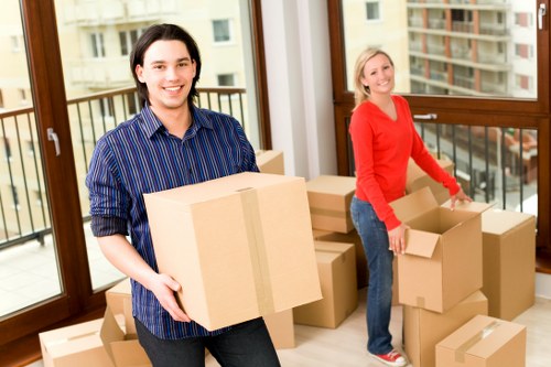 Staff member handling a removal service complaint professionally