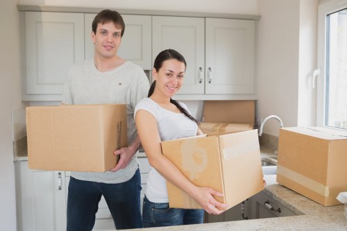 Packed household boxes and furniture prepared for a Hampstead house move